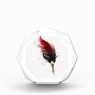 Red feather pen with gold nib photo block
