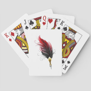 Red feather pen with gold nib playing cards