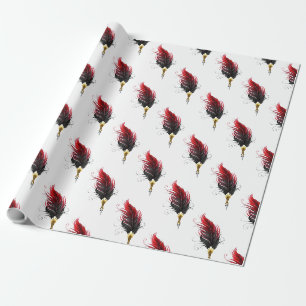 Red feather pen with gold nib wrapping paper