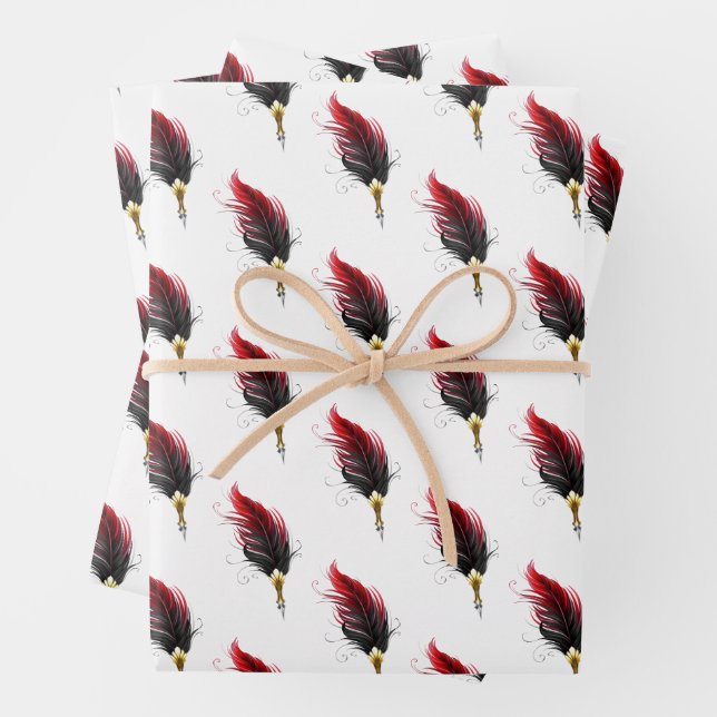 Red feather pen with gold nib wrapping paper sheet (In situ)