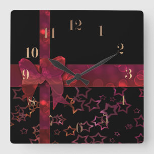 Red glitter bow and stars on black square wall clock