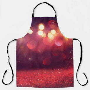 Red glitter vintage lights background. defocusedba apron