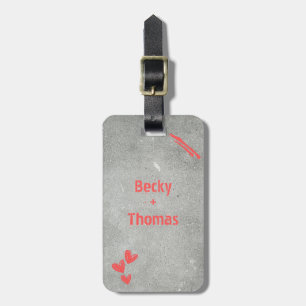 Red graffiti name on grey concrete, your  luggage tag