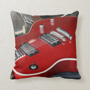 Red guitar on amp cushion