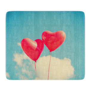 Red Heart Balloons Against Cloudy Sky Cutting Board