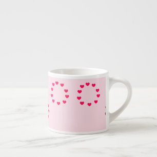 red heart circles on pink espresso cup