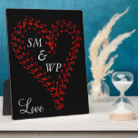 Red Heart Couple's Monogram Plaque<br><div class="desc">Large red heart formed from musical notes in the centre against a black background.  Couple's monogrammed initials are written inside of romantic heart in silver grey text.  Love is written below heart in pretty script.  Nice gift idea for your sweetheart. Original Artwork Design by TamiraZDesigns.</div>