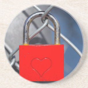 Red heart lock on fence coaster