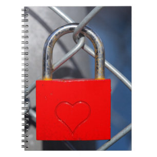 Red heart lock on fence notebook
