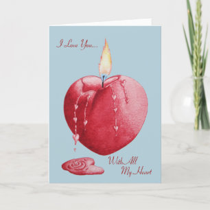 Red heart shaped burning candle with love verse card