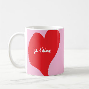 Red heart with je t’aime-text on pink background coffee mug