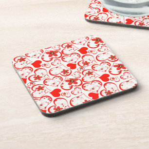 Red hearts and flowers on a white coaster
