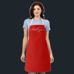 Red Holiday Christmas kitchen Personalised script  Apron<br><div class="desc">Celebrate the joy of the season with our Personalised Red Holiday Apron, a thoughtful and festive gift that brings warmth and style to every kitchen. This vibrant red apron, personalised with a custom name in elegant script, adds a cheerful touch to holiday baking, cooking, and family gatherings. Whether you’re whipping...</div>