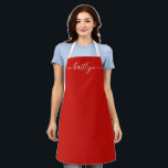 Red Holiday Christmas kitchen Personalised script Apron<br><div class="desc">Celebrate the joy of the season with our Personalised Red Holiday Apron, a thoughtful and festive gift that brings warmth and style to every kitchen. This vibrant red apron, personalised with a custom name in elegant script, adds a cheerful touch to holiday baking, cooking, and family gatherings. Whether you’re whipping...</div>