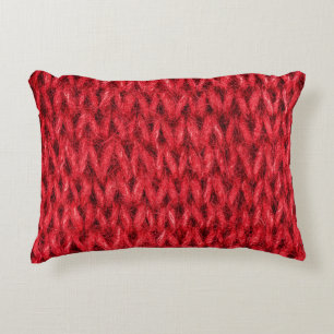 Red knitting wool texture background. decorative cushion