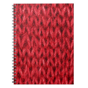 Red knitting wool texture background. notebook