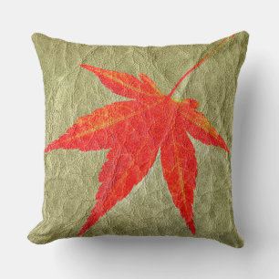 Red Leaf on Tan Leather Cushion