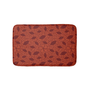 Red leaves pattern on orange bath mat