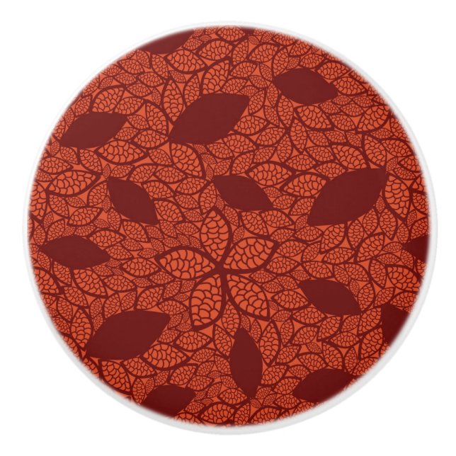 Red leaves pattern on orange ceramic knob (Front)