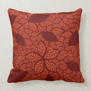 Red leaves pattern on orange cushion