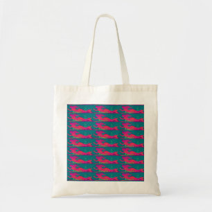 red mermaids swimming tote bag