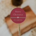Red | Modern Bow Simple Minimal Christmas Classic Round Sticker<br><div class="desc">Finish your holiday mailings and gifts with these sweet and simple Christmas stickers,  customisable with your preferred holiday greeting and family signature (shown with "Merry Christmas") on a red background. A petite bow running through the centre completes this elegant minimalist holiday design.</div>