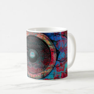 Red music speakers on a cracked wall coffee mug