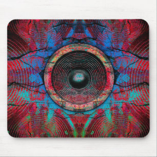 Red music speakers on a cracked wall mouse pad