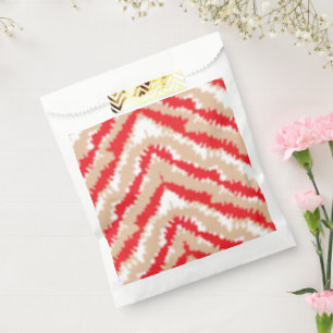 Red, orange, and pink textured patterns and motifs favour bag