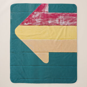Red, orange, and yellow arrow signage sherpa blanket