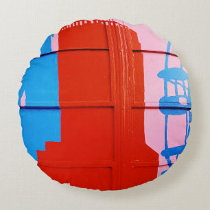 Red painted wall round cushion