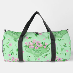 Red pansies green bowl and background duffle bag