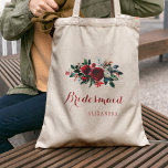 Red peony bouquet winter wedding bridesmaid tote bag<br><div class="desc">Rustic elegant floral wedding stylish bridesmaid / maid of honour / flower girl tote bag featuring a watercolor red burgundy and white peonies winter bouquet with seasonal pine green bir branches, red berries and foliage and whit your custom text. Fill in your information in the spots, You can choose to...</div>