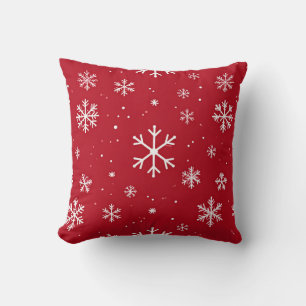 Red pillow with white snowflake pattern