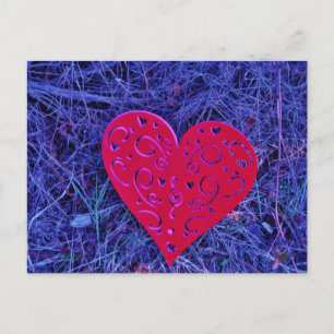 Red Pink heart on purple grass. Postcard