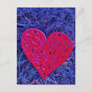 Red Pink heart on purple grass. Postcard