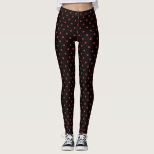 Red polka dot pattern on black leggings