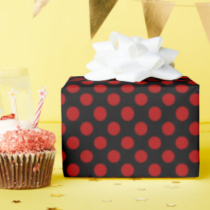 red polka dots on black wrapping paper