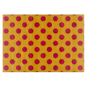 Red polka dots on yellow cutting board