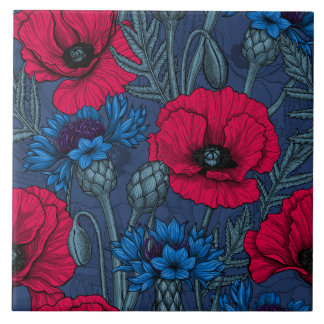 Red poppies and blue cornflowers on blue ceramic tile
