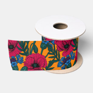 Red poppies and blue cornflowers on orange satin ribbon