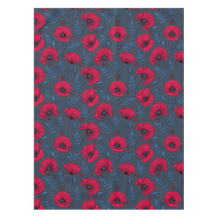 Red poppies and ladybugs on dark blue tablecloth