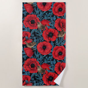Red poppies and wrens, blue leaves on black beach towel