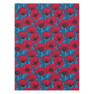 Red poppy garden on blue tablecloth