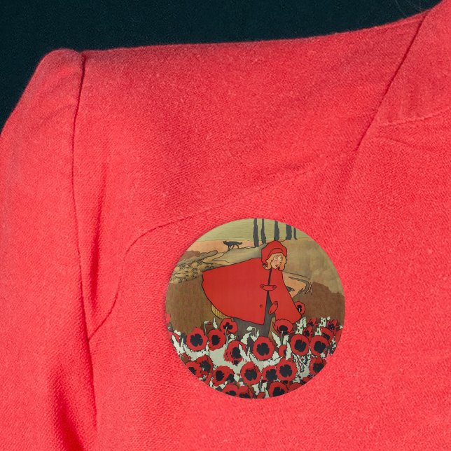 Red Riding Hood Picking Poppies Button (Red Riding hood in red cape picking red poppy flowers in field wolf on round pink back button.)
