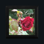 Red Roses and Love Anniversary Trinket Box<br><div class="desc">This customisable jewellery box has a bunch of dripping wet red roses, and the word "Love" on it, which would make it an ideal wedding or anniversary gift box for storing a special gift in, or let it be the gift itself for your special someone to store treasured mementos or...</div>