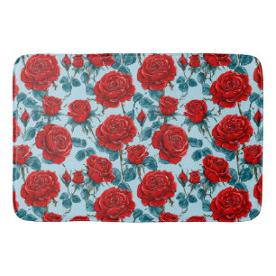 Red roses on a blue background bath mat
