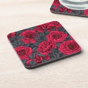 Red roses with grey leaves on black coaster