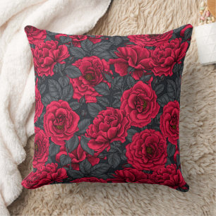 Red roses with grey leaves on black cushion