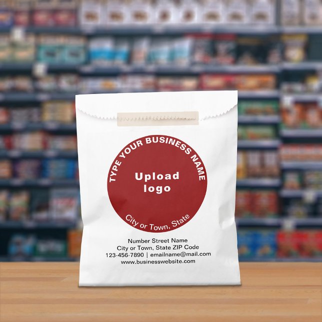 Red Round Business Brand on Paper Bag (Paper bag with red round business branding displayed in a store)